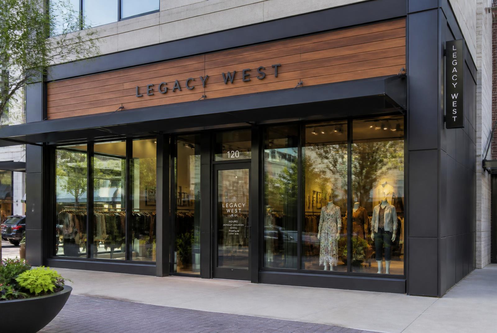 Finished retail storefront with glass entry, metal framing and wood facade